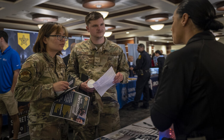 Service members speak with potential employers during a career fair at MacDill Air Force Base, Florida, April 13, 2023. The event provided opportunities for active duty, guard, reserve, Department of Defense civilians and spouses to speak with more than 70 local and international employers. (U.S. Air Force photo by Senior Airman Lauren Cobin)