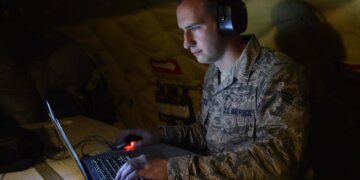 Senior Airman Ryan Zeski utilizes time during a long flight as a passenger on a Michigan Air National Guard KC-135 Stratotanker to work on some homework for a course he is taking at Oakland University in MIchigan, Nov. 8, 2018. Zeski is one of more than 250 Michigan Citizen-Airmen who are utilizing state or federal tuition assistance to further his education through his military service. (U.S. Air National Guard photo by Tech. Sgt. Dan Heaton)