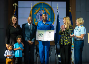 Cmdr. Andre Douglas joins the Coast Guard Reserve during a commissioning ceremony presided over by Adm. Linda L. Fagan, commandant of the Coast Guard, at Coast Guard Headquarters in Washington, D.C., March 19, 2024. Douglas, a Coast Guard Academy Class of 2008 graduate, reported to NASA in January, 2022, and completed astronaut training March 5, 2024. Photo by Petty Officer 1st Class Brandon Giles