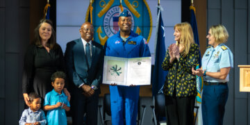 Cmdr. Andre Douglas joins the Coast Guard Reserve during a commissioning ceremony presided over by Adm. Linda L. Fagan, commandant of the Coast Guard, at Coast Guard Headquarters in Washington, D.C., March 19, 2024. Douglas, a Coast Guard Academy Class of 2008 graduate, reported to NASA in January, 2022, and completed astronaut training March 5, 2024. Photo by Petty Officer 1st Class Brandon Giles