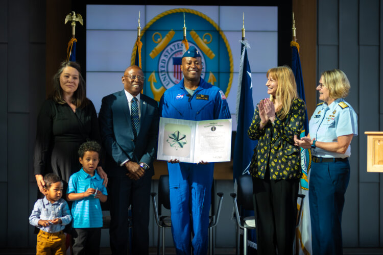 Cmdr. Andre Douglas joins the Coast Guard Reserve during a commissioning ceremony presided over by Adm. Linda L. Fagan, commandant of the Coast Guard, at Coast Guard Headquarters in Washington, D.C., March 19, 2024. Douglas, a Coast Guard Academy Class of 2008 graduate, reported to NASA in January, 2022, and completed astronaut training March 5, 2024. Photo by Petty Officer 1st Class Brandon Giles
