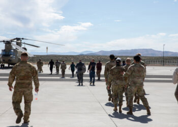 Soldiers and civilians, walking towards the CH-47 Chinook at Stead, Nevada, on June 18, 2026. Photo by Staff Sgt. Enrique Ortega Dominguez