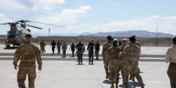 Soldiers and civilians, walking towards the CH-47 Chinook at Stead, Nevada, on June 18, 2026. Photo by Staff Sgt. Enrique Ortega Dominguez
