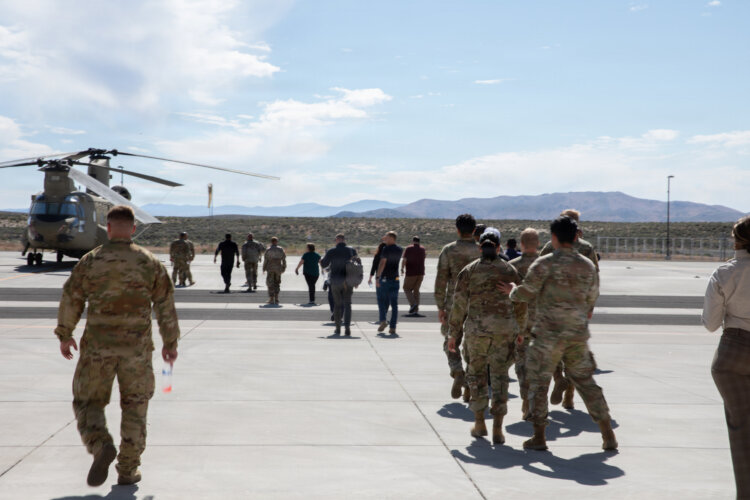 Soldiers and civilians, walking towards the CH-47 Chinook at Stead, Nevada, on June 18, 2026. Photo by Staff Sgt. Enrique Ortega Dominguez