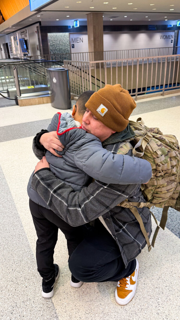 Sarah's husband says goodbye to their son ahead of his deployment. Courtesy photo