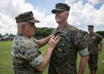 Navy Rear Adm. Anthony Lacourse, reserve medical officer, Marine Forces Reserve, pins Fleet Marine Force insignia on Lt. Cmdr. David Westerberg, a dentist, 4th Dental Battalion, during a Fleet Marine Force (FMF) pinning ceremony at Marine Force Support Facility New Orleans, June 11, 2026.
