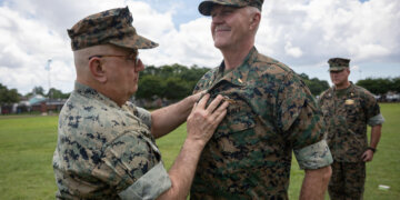 Navy Rear Adm. Anthony Lacourse, reserve medical officer, Marine Forces Reserve, pins Fleet Marine Force insignia on Lt. Cmdr. David Westerberg, a dentist, 4th Dental Battalion, during a Fleet Marine Force (FMF) pinning ceremony at Marine Force Support Facility New Orleans, June 11, 2026.